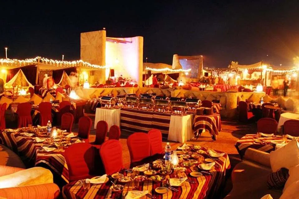 VIP Desert Safari premium seating with exclusive table service at luxury Dubai desert camp